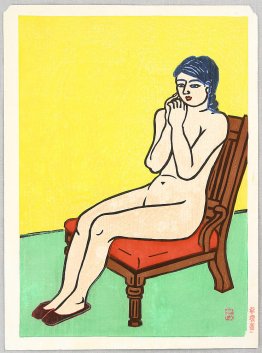 Nu sur une chaise rouge