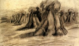 Stooks et un paysan d'empilement paysan
