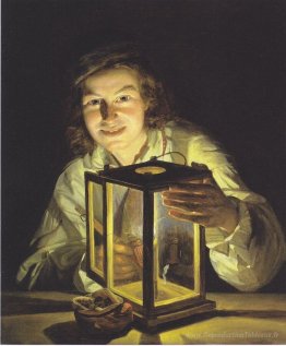 Le jeune garçon avec le lantern stable