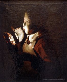 Garçon soufflant à la lampe