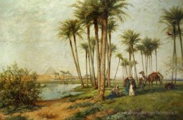 Bédouin à une oasis avec des pyramides