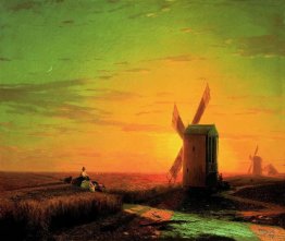 Moulins à vent dans la steppe ukrainienne au coucher du soleil