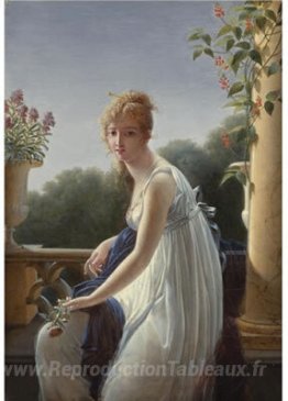 Une jeune femme assise par une fenêtre