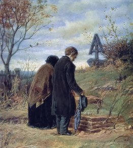 De vieux parents visitant la tombe de leur fils