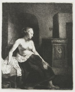 Femme assise à moitié habillée à côté d'un poêle