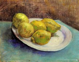 Nature morte avec des citrons sur une assiette
